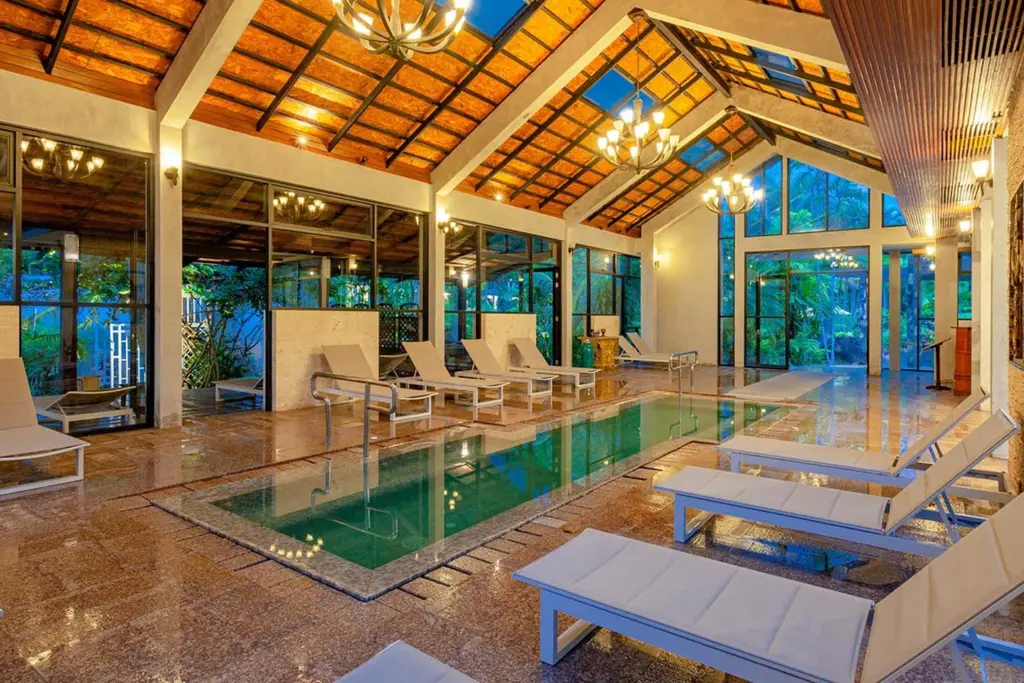 Indoor cold water pool and loungers at The Hotspring Beach Resort & Spa