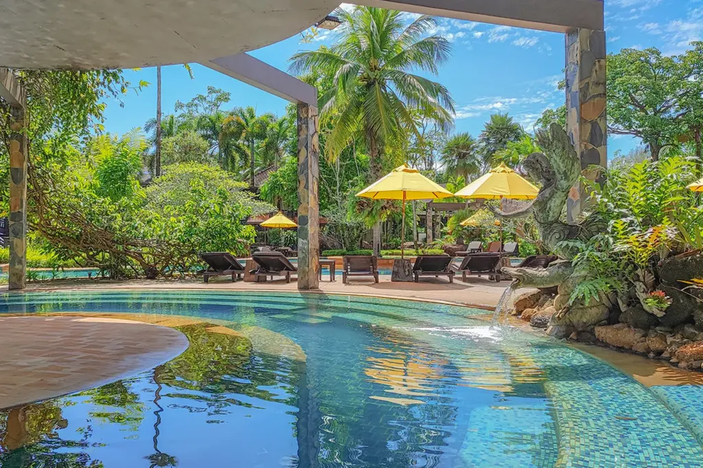 Outdoor pool area included with the Day Pass at The Hotspring Beach Resort & Spa