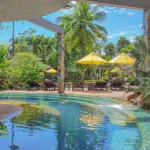 Outdoor pool area included with the Day Pass at The Hotspring Beach Resort & Spa